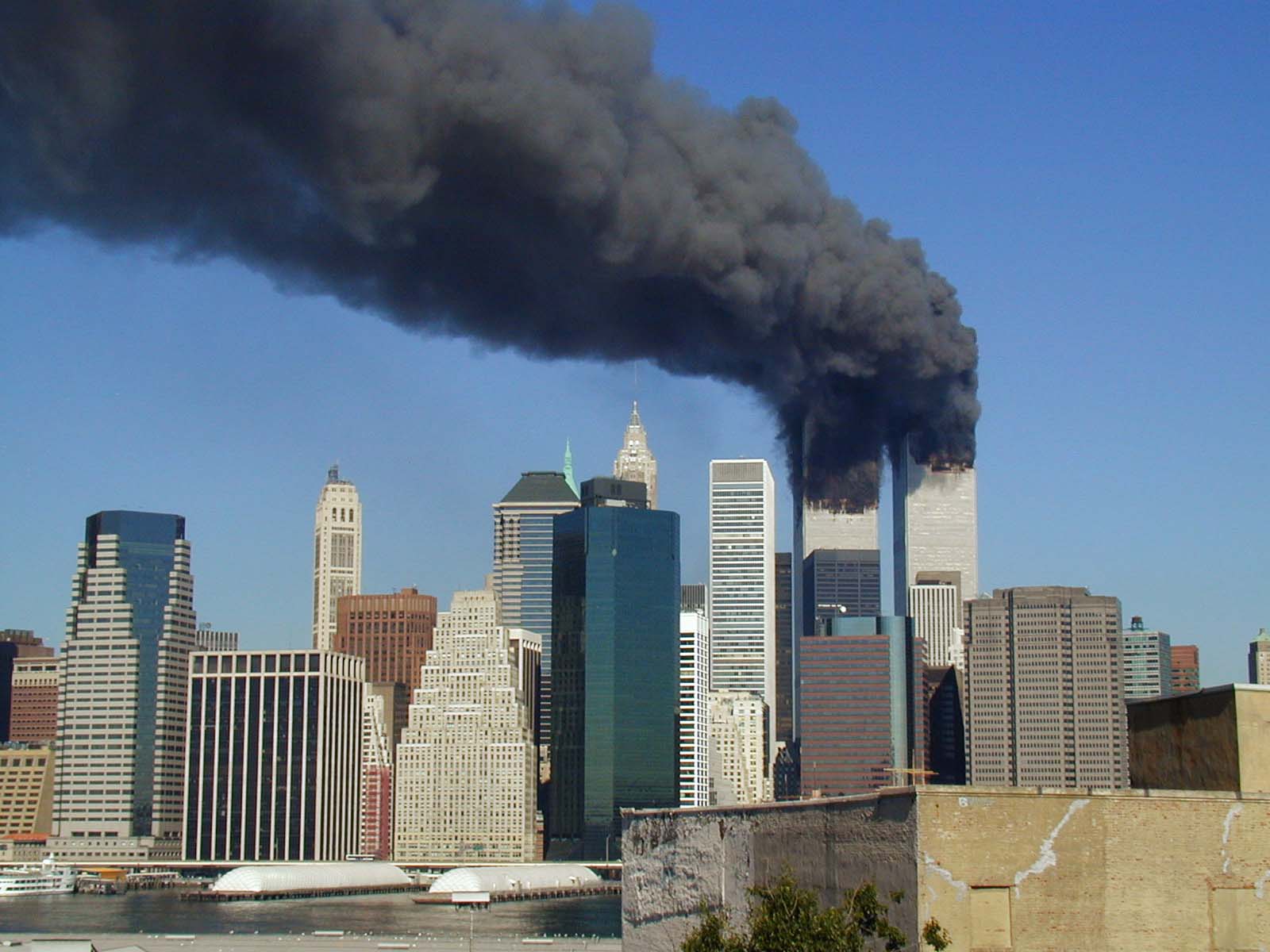 World Trade Towers smoking after attack. Photo by Michael Foran, via Flickr, Wikimedia